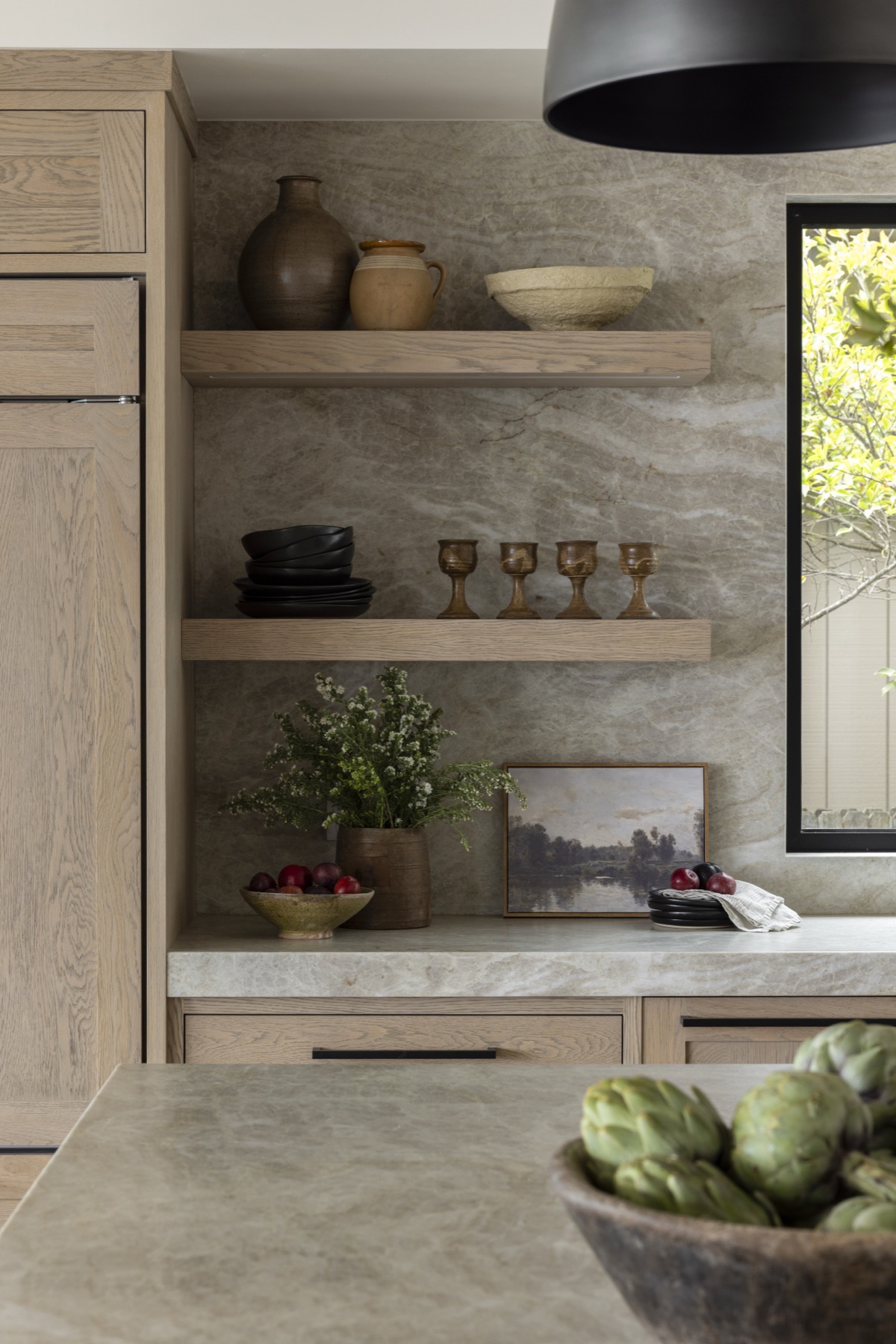 Coastal Urban, open oak shelving against a stone slab wall