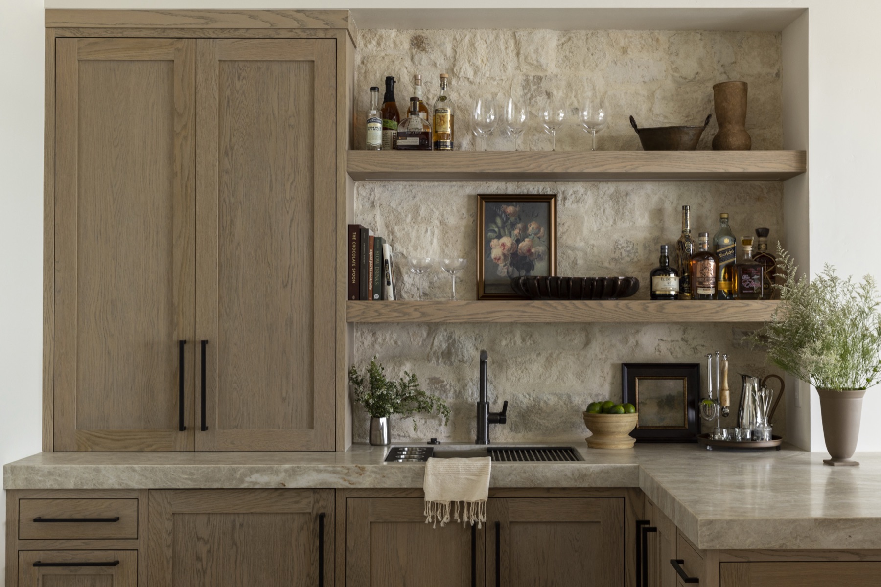 Coastal Urban, the bar with a limestone wall and floating oak shelves