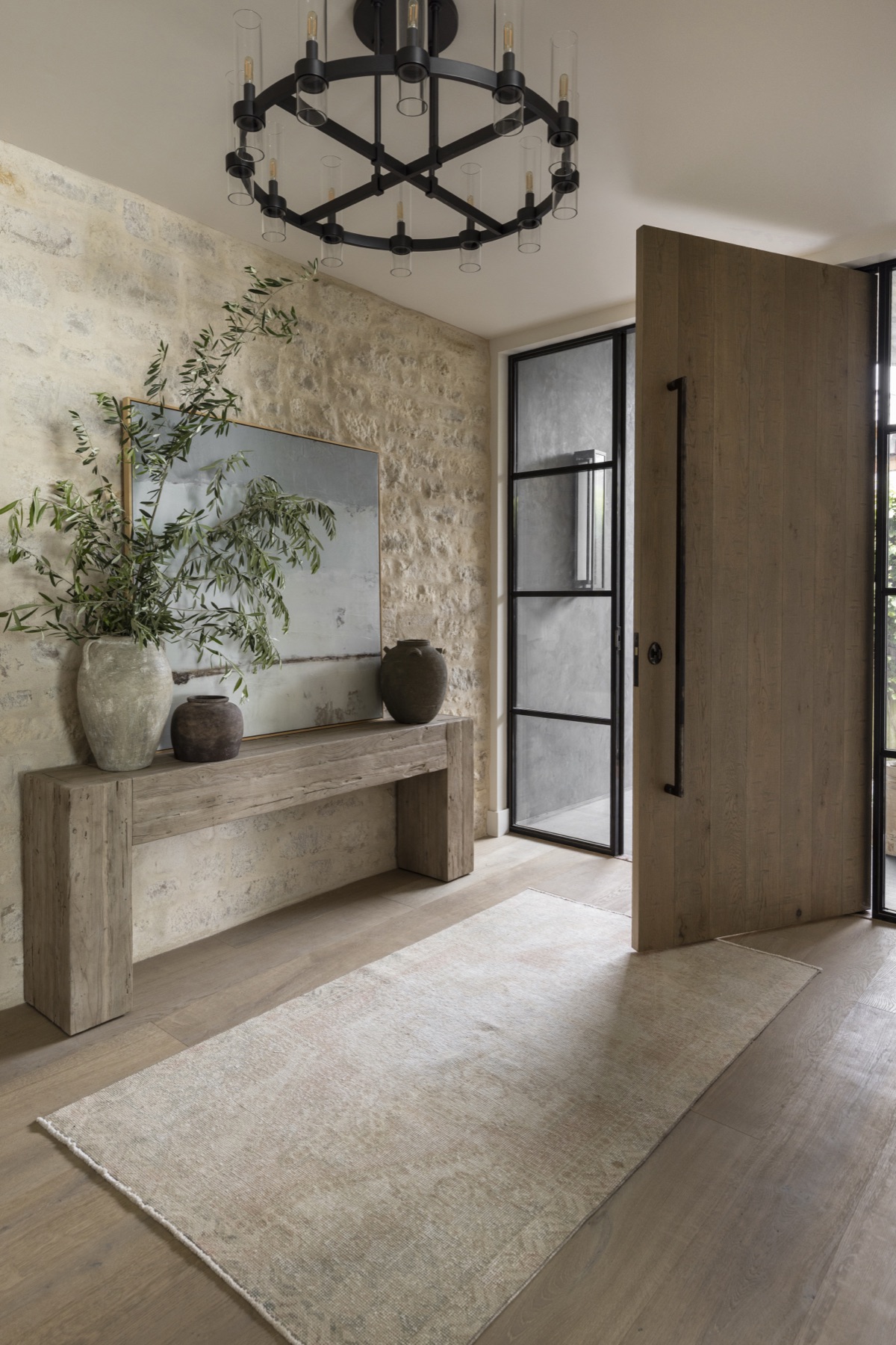 Coastal Urban, the entry with a round black chandelier