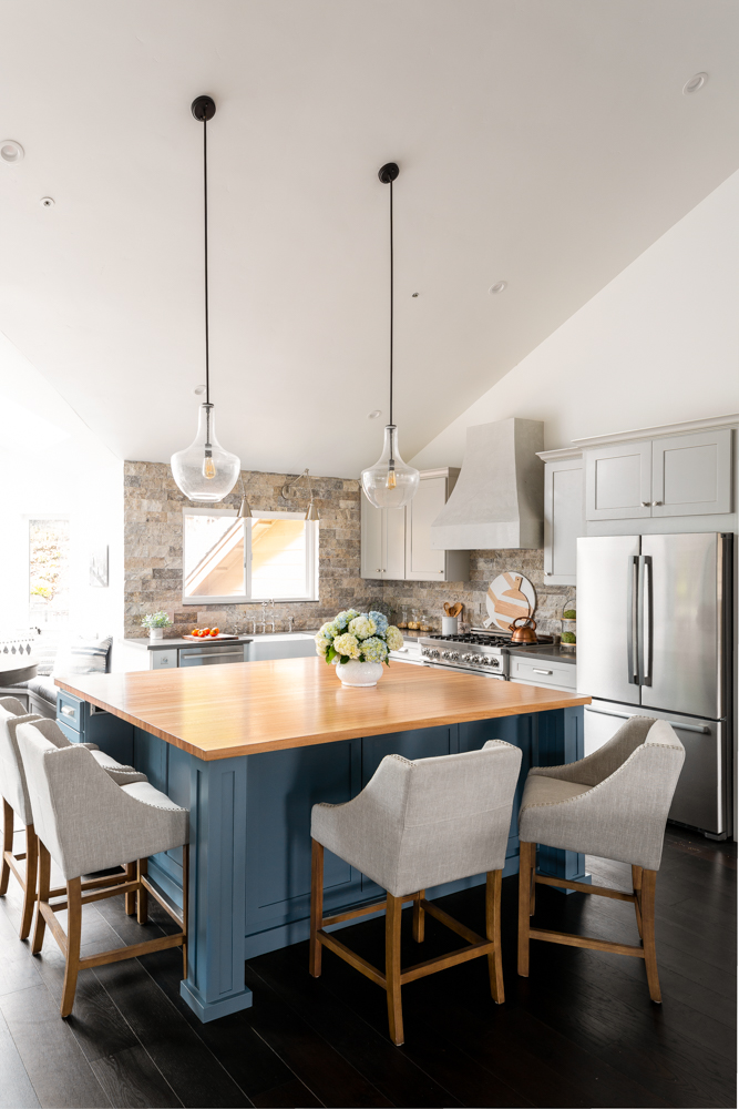 Modern Bungalow, the kitchen with a blue island and butcher-block top